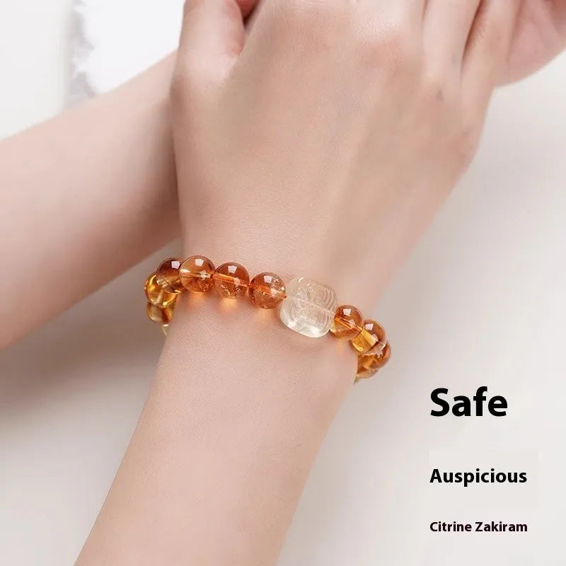 Women's ethnic style bracelet with a carved 10mm citrine crystal geometry bead.