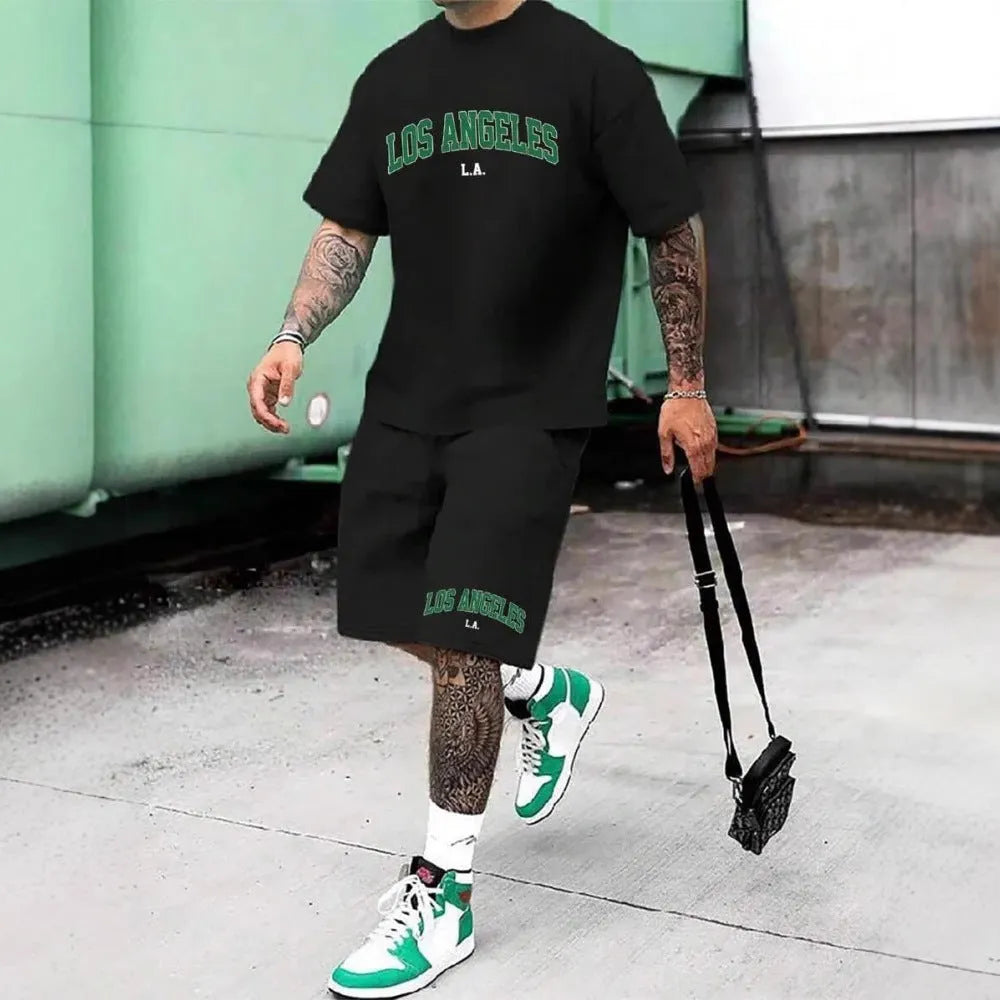Man wearing a grey 3D printed letter short sleeve top and matching shorts suit set.
