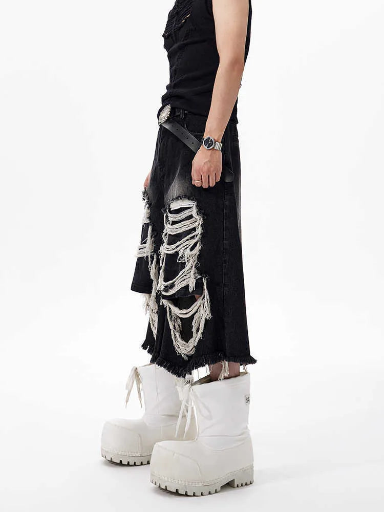 Black women's cropped wide-leg jeans with mid-high waist and ripped patch detail