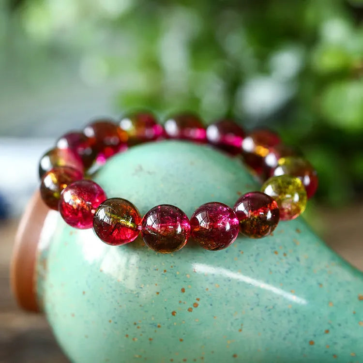 Women's watermelon crystal bracelet showing four size options from 6mm to 12mm diameter