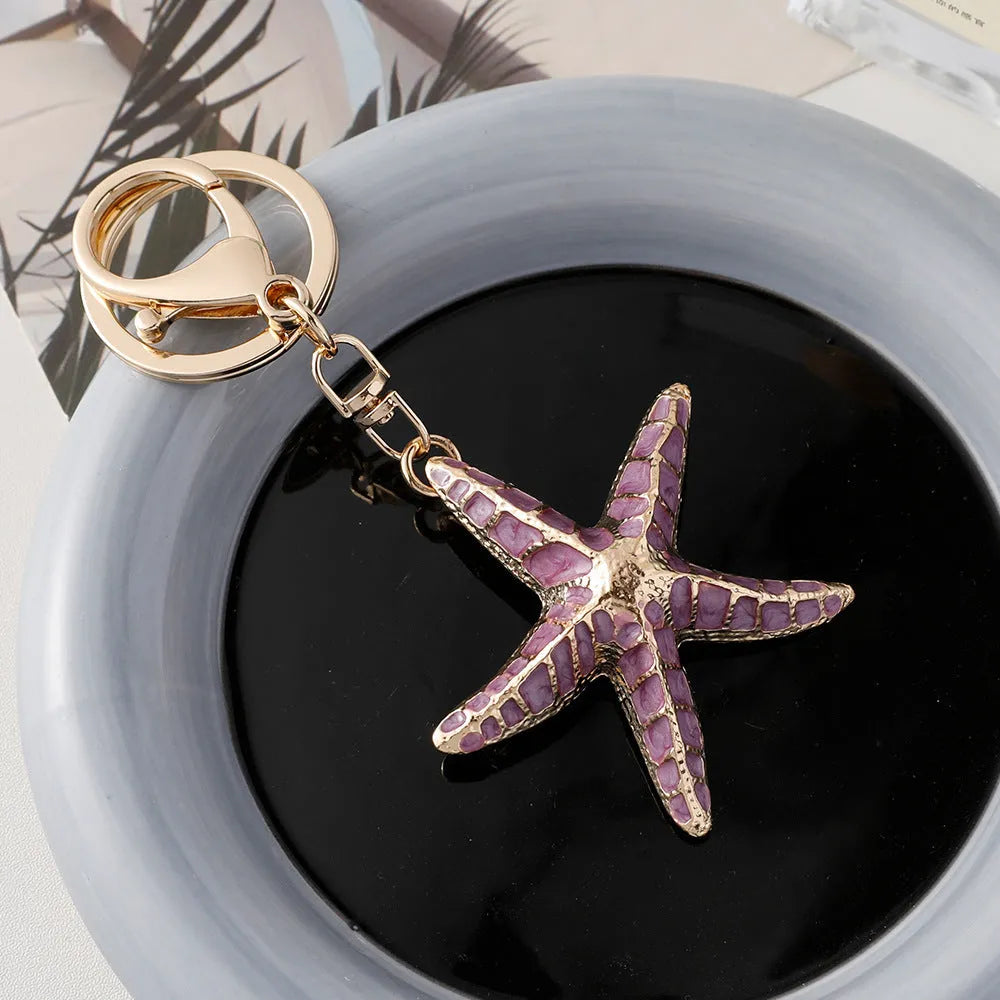 Ocean Series starfish shell keychain with electroplated finish in blue pink and purple colours