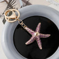 Ocean Series starfish shell keychain with electroplated finish in blue pink and purple colours