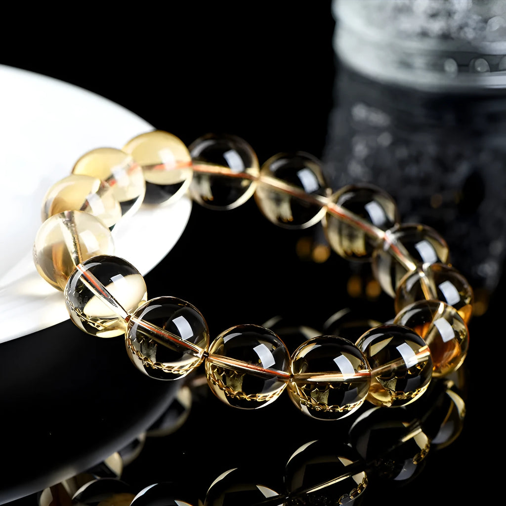 Original design natural citrine scattered beads ball bracelet showing polished yellow stones.