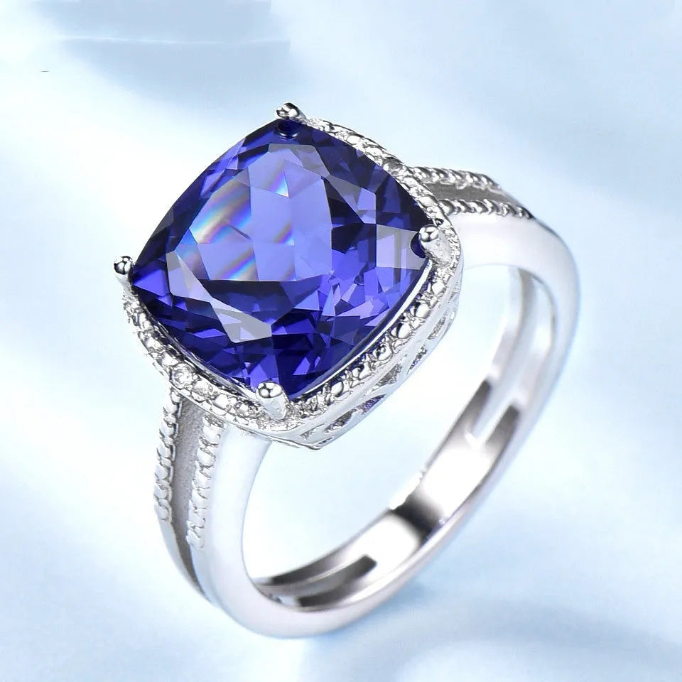 Women's 925 sterling silver ring with blue Tanzanite gemstone centrepiece