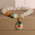Women's ice jade crystal bracelet with a pearl detail and traditional Chinese jade buckle.
