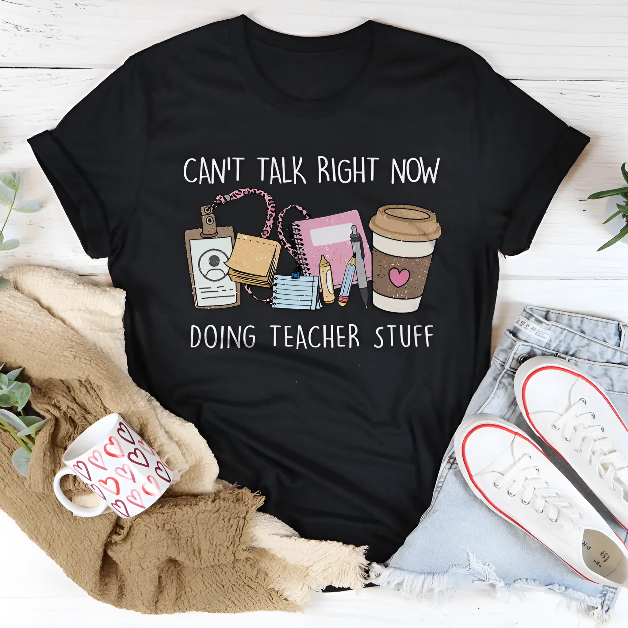 Black straight fit cotton short sleeve t-shirt with round neck on a hanger
