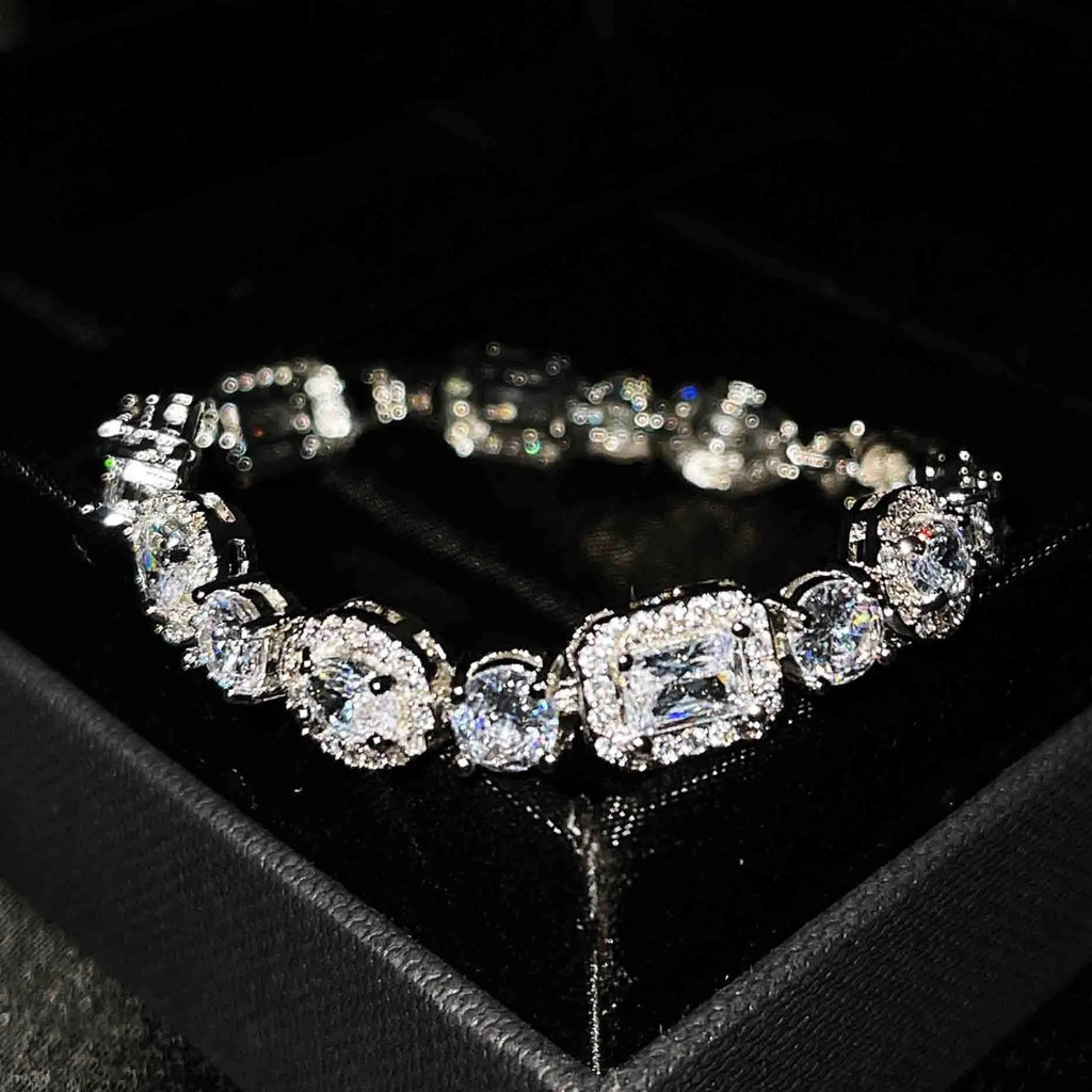 Women's sterling silver-plated bracelet with zircon stones on a geometry-patterned chain.