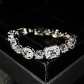 Women's sterling silver-plated bracelet with zircon stones on a geometry-patterned chain.