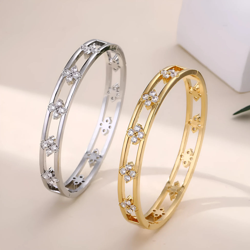 Gold and silver hollow women's bracelets with four-leaf clover charms and zircon stones.