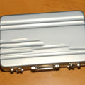 Aluminium alloy metal card holder in six colour options showing compact size.
