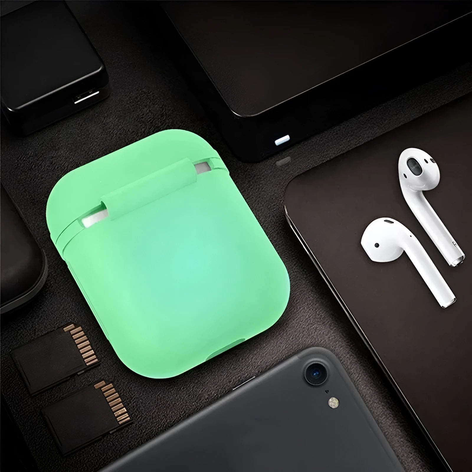 Luminous coloured silicone flip-top protective case for Apple AirPods earphones.