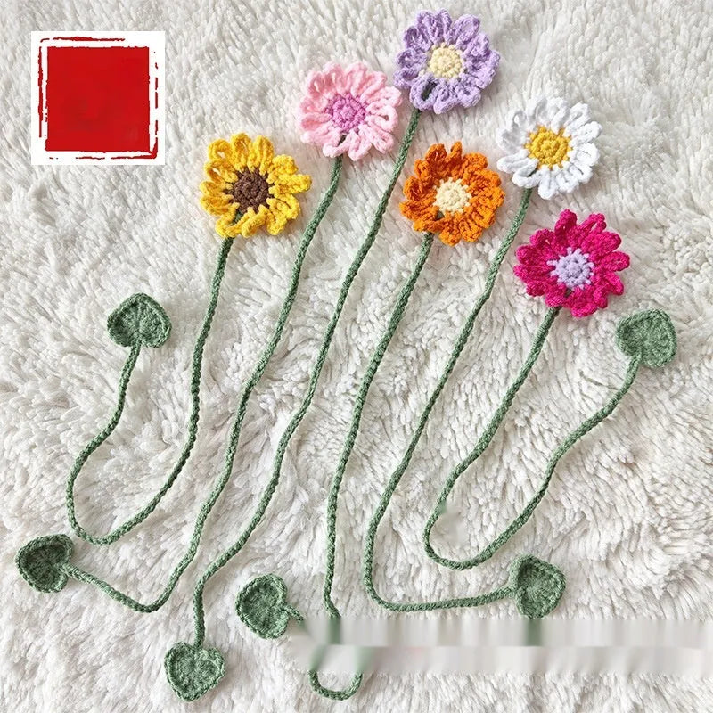 Hand-crocheted wool bookmark with a small daisy design in yellow milk cotton yarn with flexible wire.