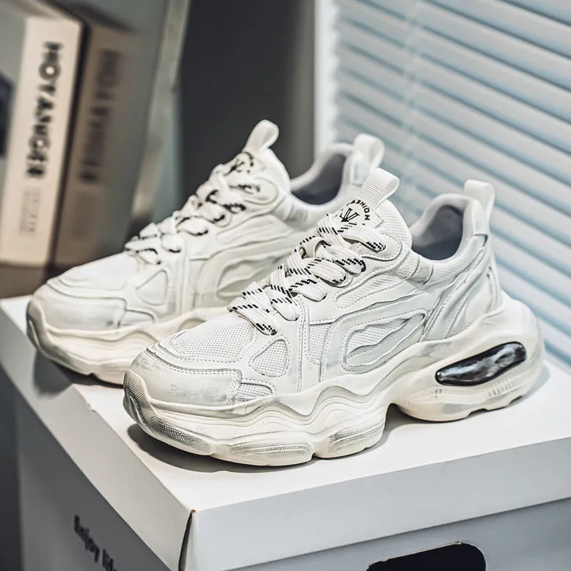 Men's black, grey, or white mesh sneakers with platform sole and lace-up front.
