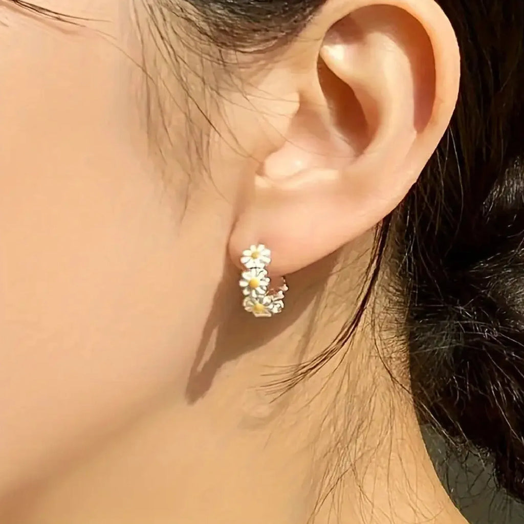 White daisy flower ring earrings with a platinum gemstone inlay on electroplated copper.