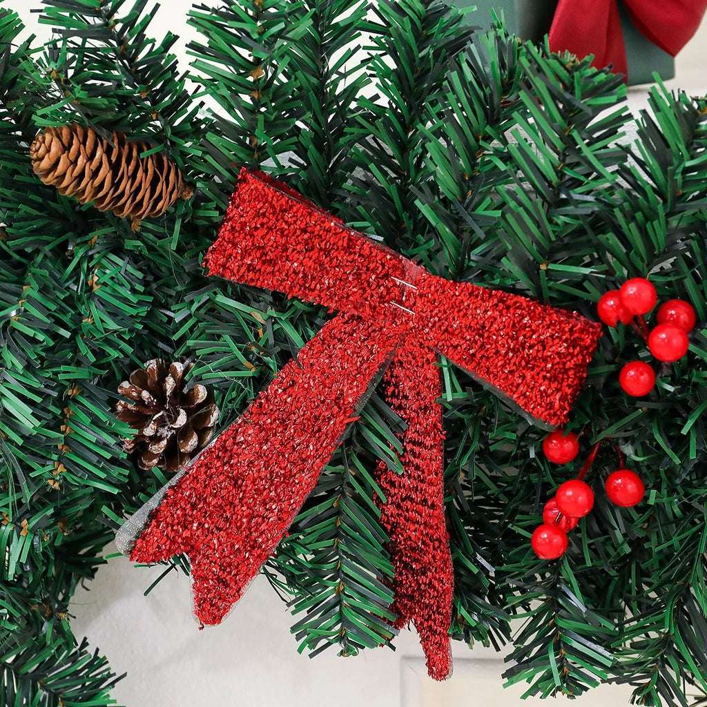 European style Christmas rattan decoration with pine cone bow design, available with coloured or warm white lighting options