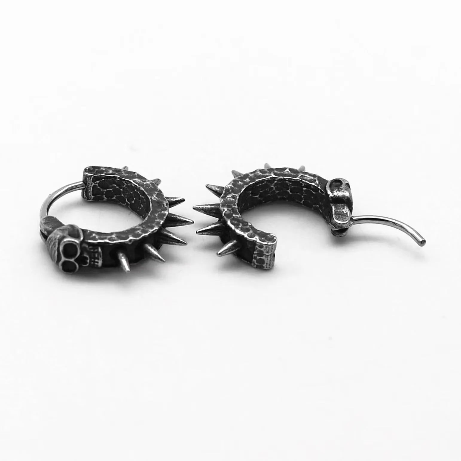 A pair of retro black alloy earrings with a geometry shape, designed with a punk motorcycle aesthetic.