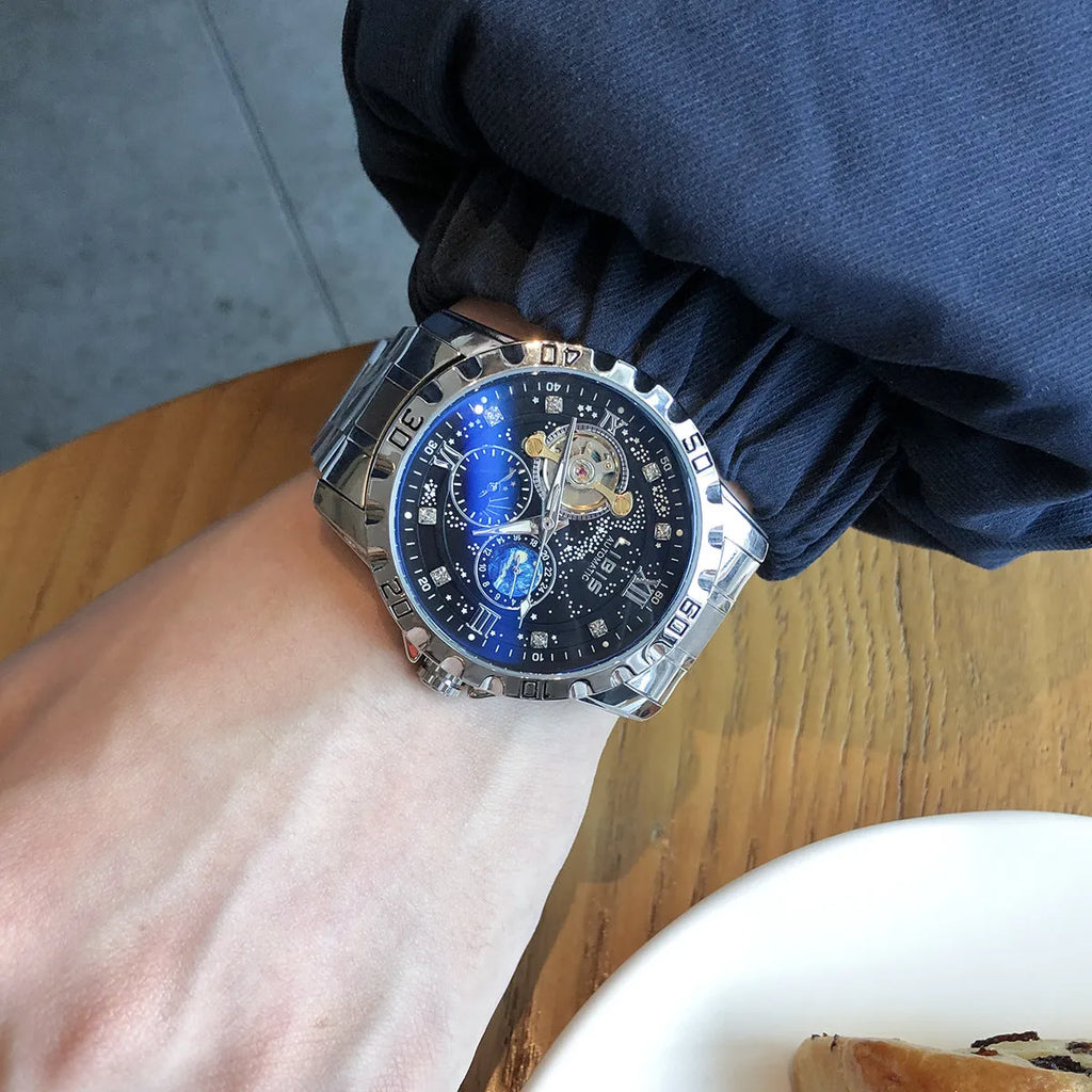 Men's silver mechanical watch with black starry dial and brown leather strap