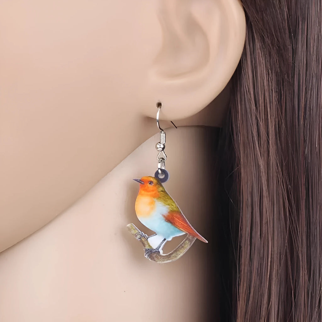 Acrylic Blue Titmouse pendant earrings with geometric and animal zodiac design including snake elements