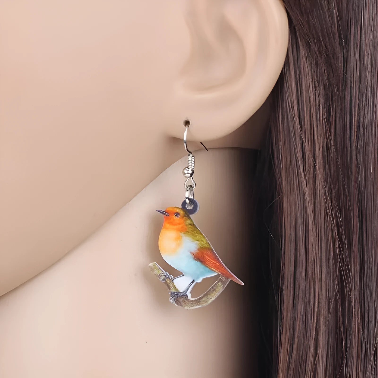Acrylic Blue Titmouse pendant earrings with geometric and animal zodiac design including snake elements