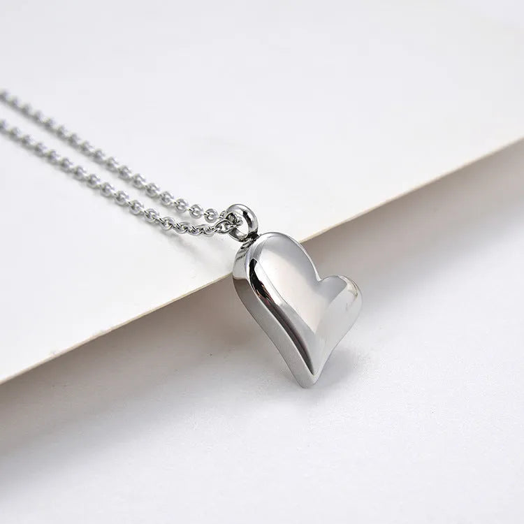 Silver stainless steel curved peach heart pendant necklace with love pattern on adjustable chain