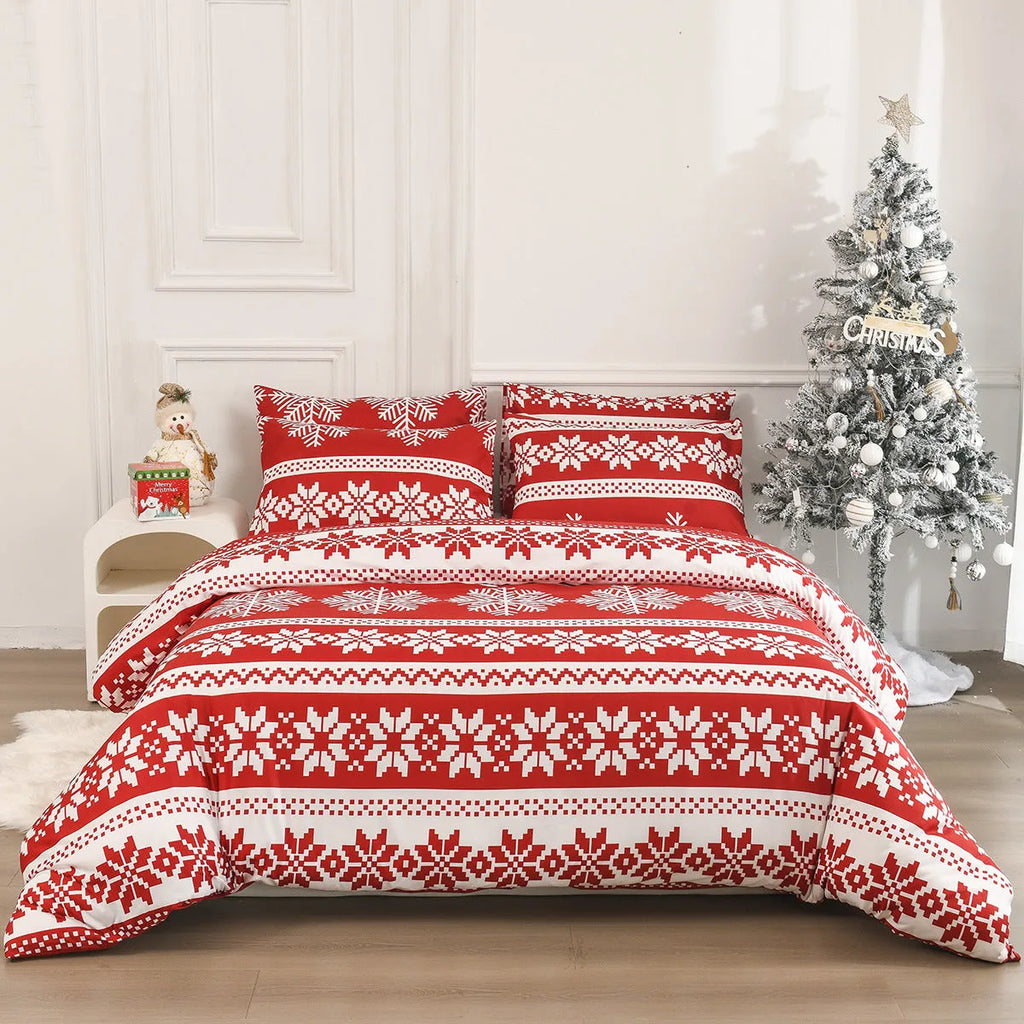Red Winter Sleepers quilt cover and pillowcases with Christmas Love Song pattern on a bed.