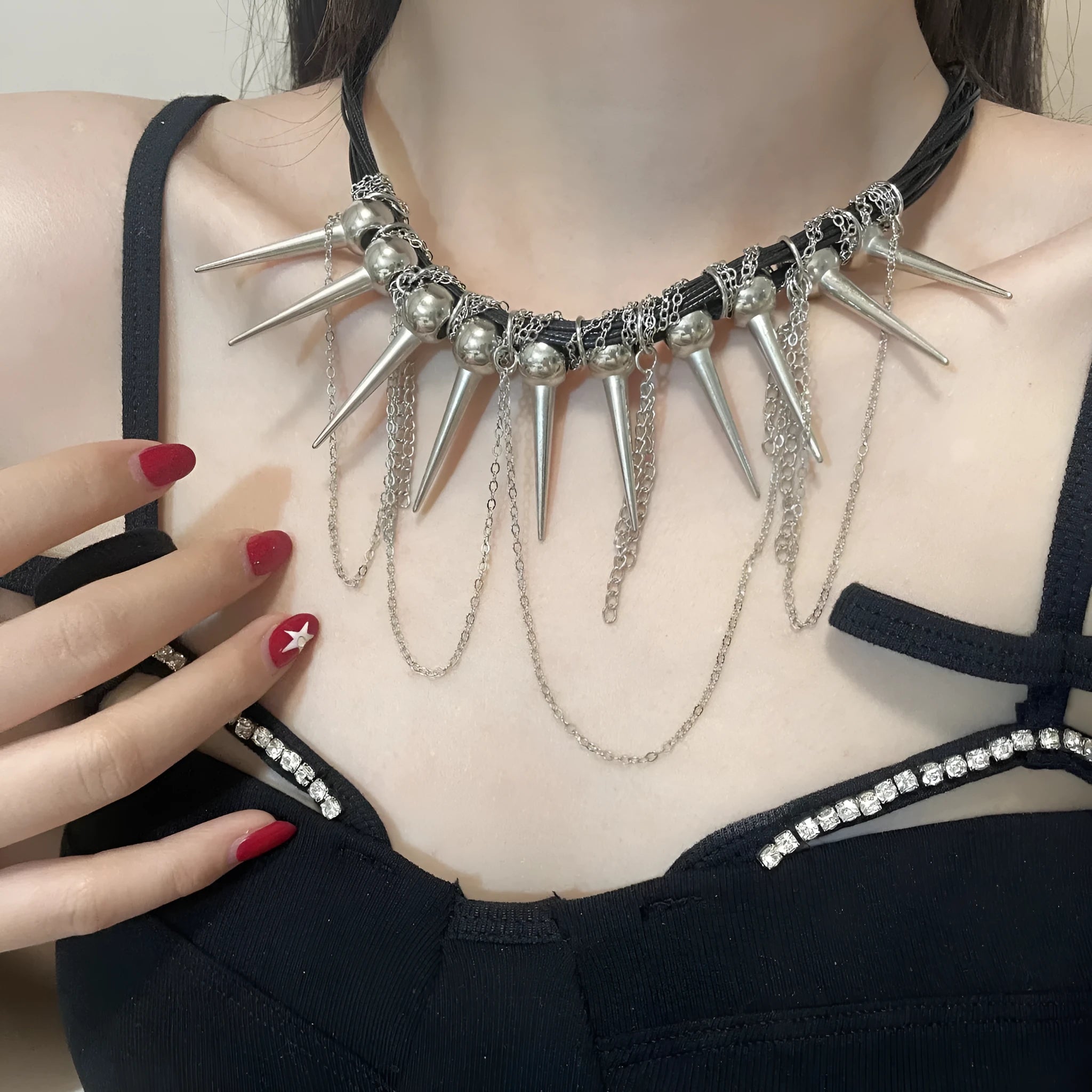 Women's casual leather necklace with electroplated round beads, a winding tassel, and point rivet details.