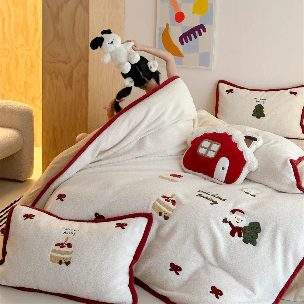 Girl's Heart cartoon pattern four-piece bedding set with winter Christmas theme on bed