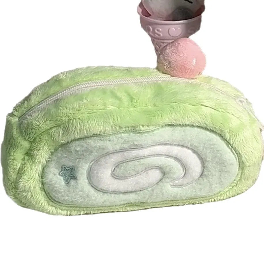 Velvet pencil case with a Swiss roll cake design, shown in a rolled-up position.