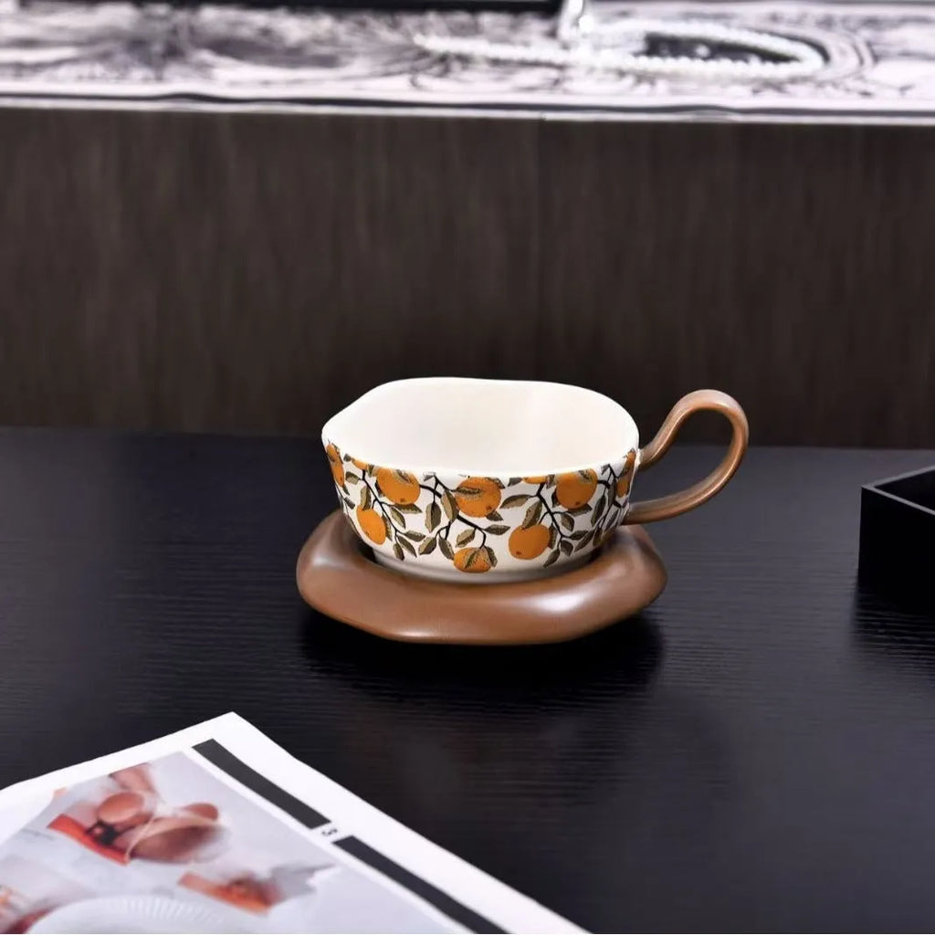 Antique style ceramic coffee cup and saucer set in black or orange medieval design, 210ml capacity.