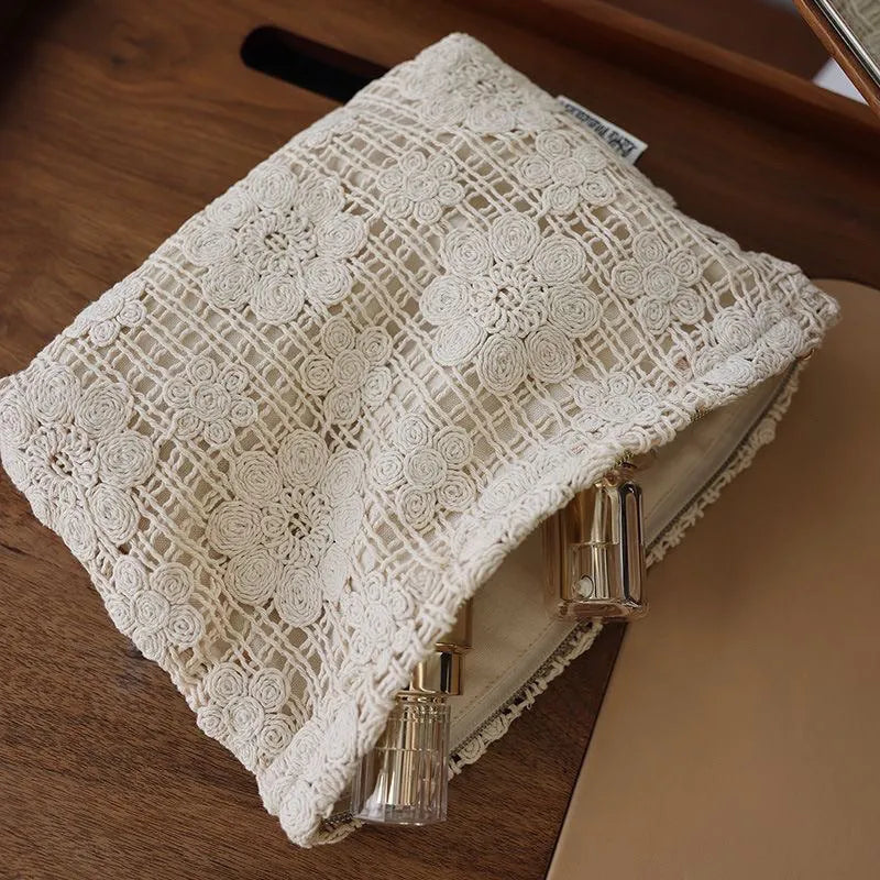 Handmade crocheted cosmetic bag with hollow floral embroidery on corduroy fabric in rope colour