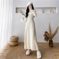 Women's beige polyester A-line mid-length dress with high waist on a model