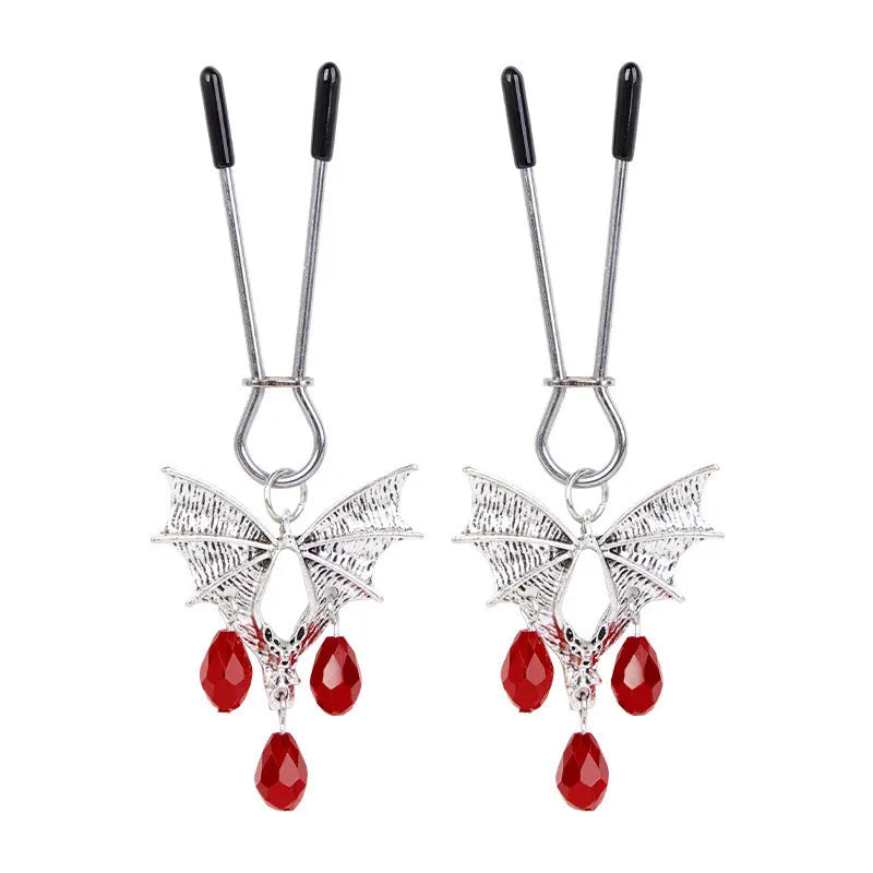 Silver bat-shaped nipple clamp with ruby detail and adjustable tension mechanism