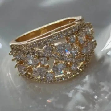 Women's round hollow copper fashion ring showing gold and platinum colour options with gemstone tone finishes