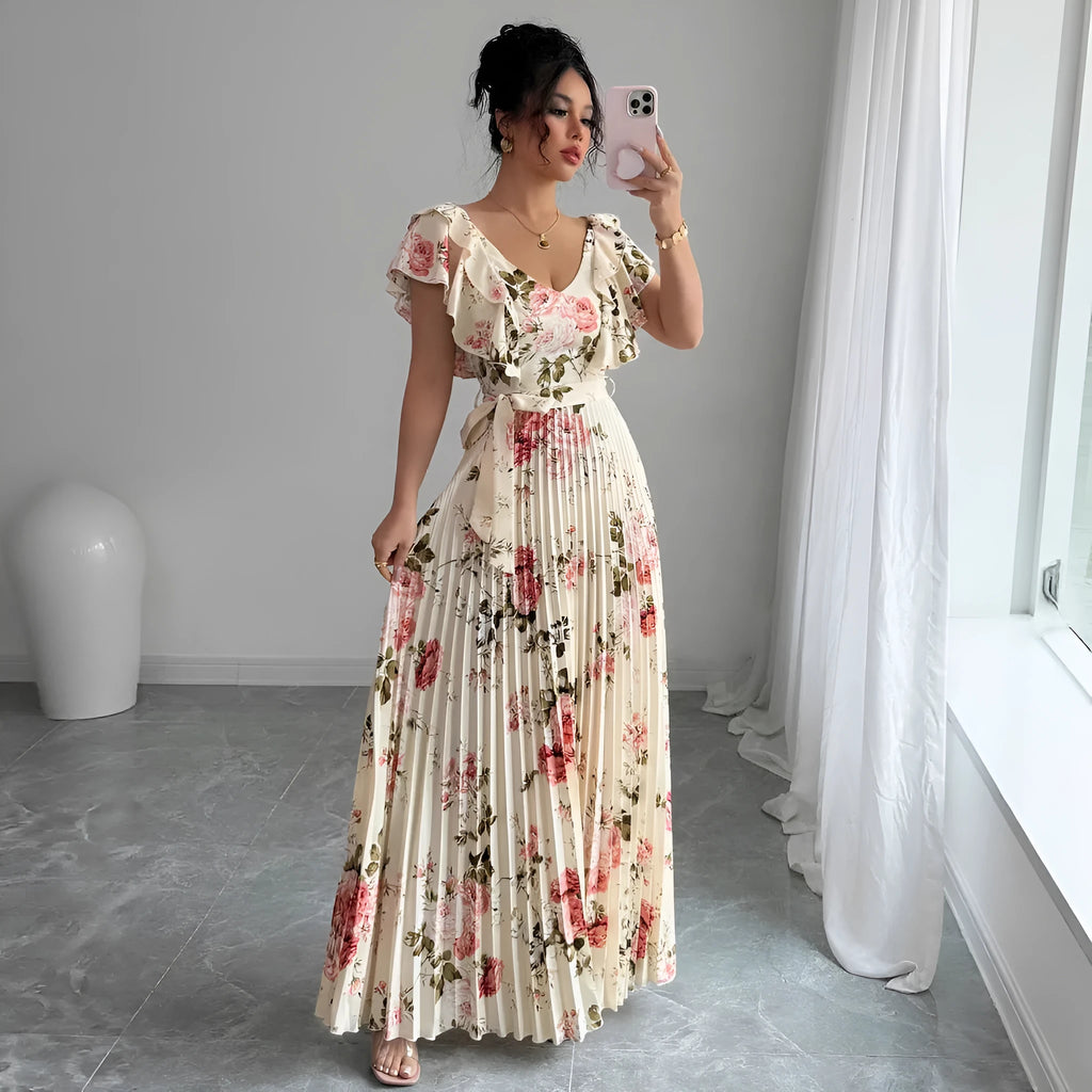 Apricot V-neck dress with digital floral print, ruffled short sleeves, and oversized pleated swing skirt.