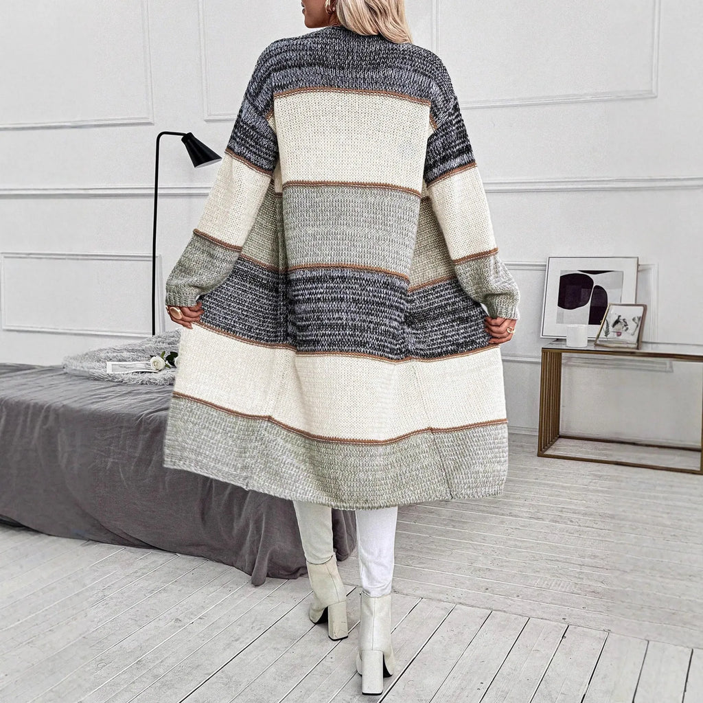 Grey loose-fit long knitted cardigan for women on a hanger, showing long sleeves and a stripe or plaid pattern.
