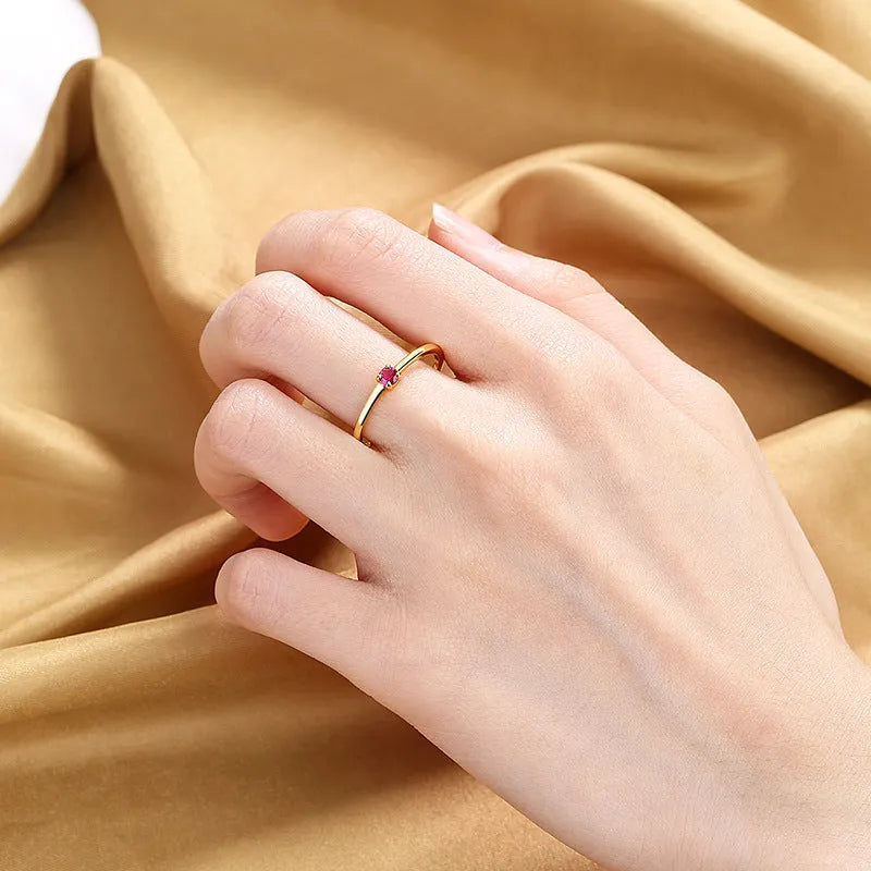 Twin Style women's geometric copper ring with a single diamond in a fine circle, shown in blue.