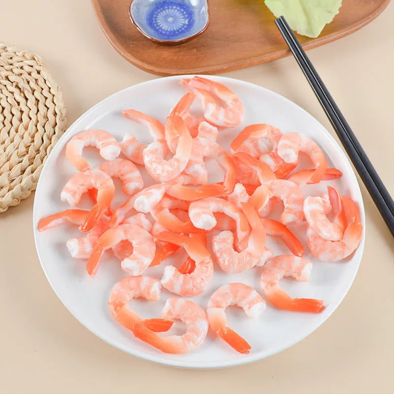 Realistic PVC shrimp-shaped keychain with door buckle attachment on white background.