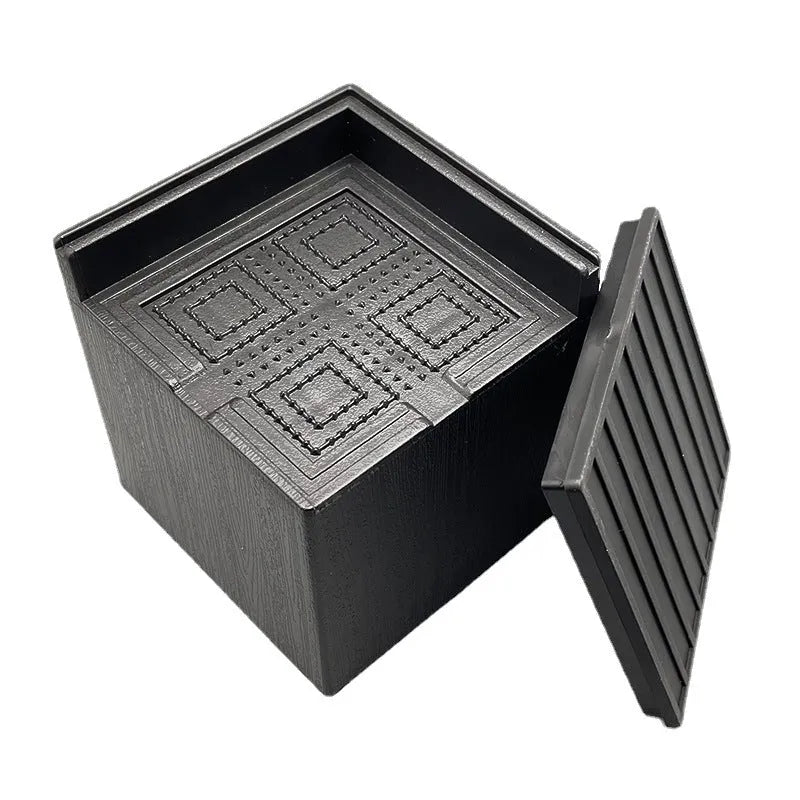 Black plastic bed and sofa foot risers four pack for furniture height adjustment