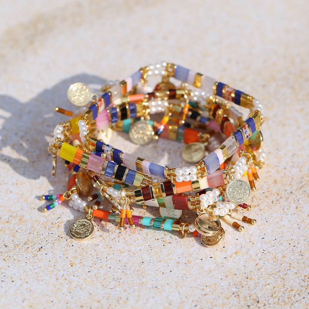 Women's imitation pearl beaded bracelet showing six pearl-lift colour variations with manual processing