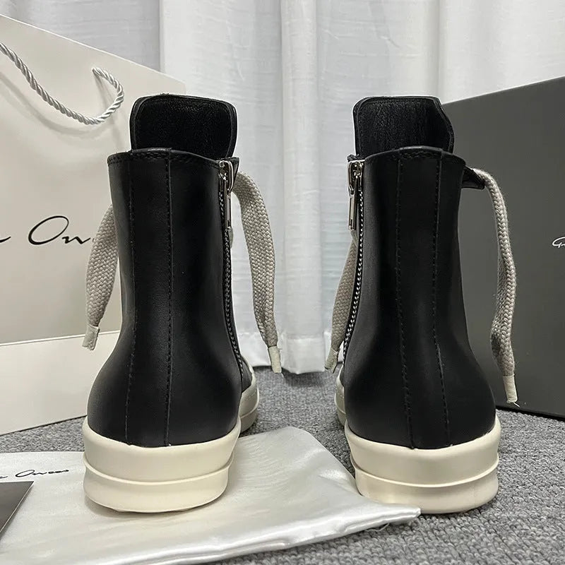 Black genuine leather high-top sneakers with side zip and stitching details on round toe design