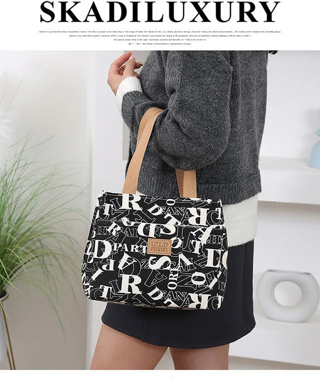 Women's printed canvas handbag with large capacity and multiple colour pattern options