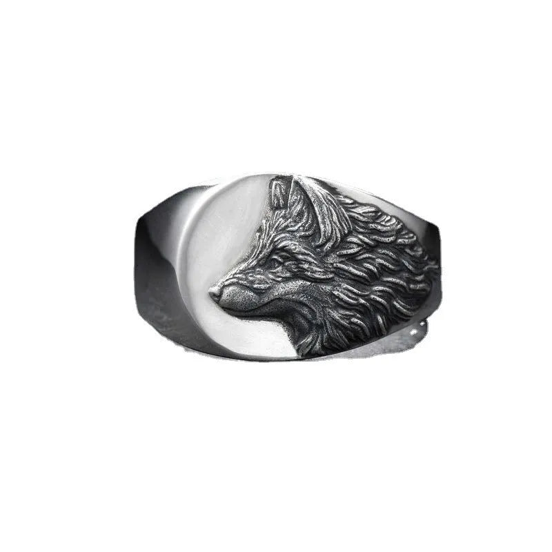 Men's silver wolf head alloy ring in geometric design on display