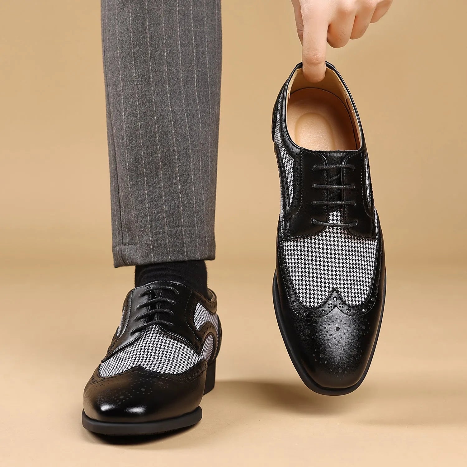 Men's black houndstooth pattern canvas casual shoes with lace-up front and rubber sole.