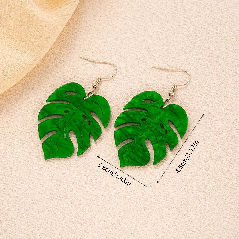 Drop-shaped acrylic earrings with summer coconut design in five colour variations on alloy ear hooks
