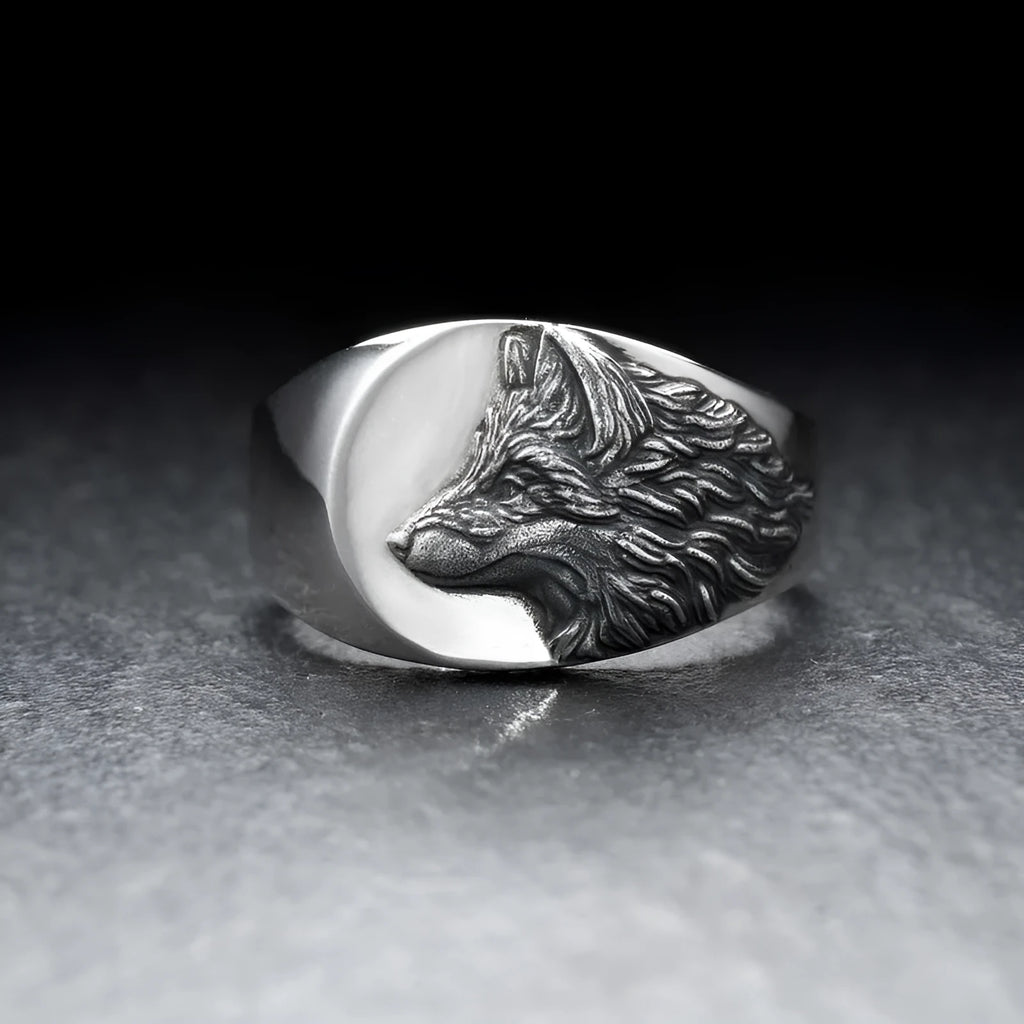Men's silver wolf head alloy ring in geometric design on display