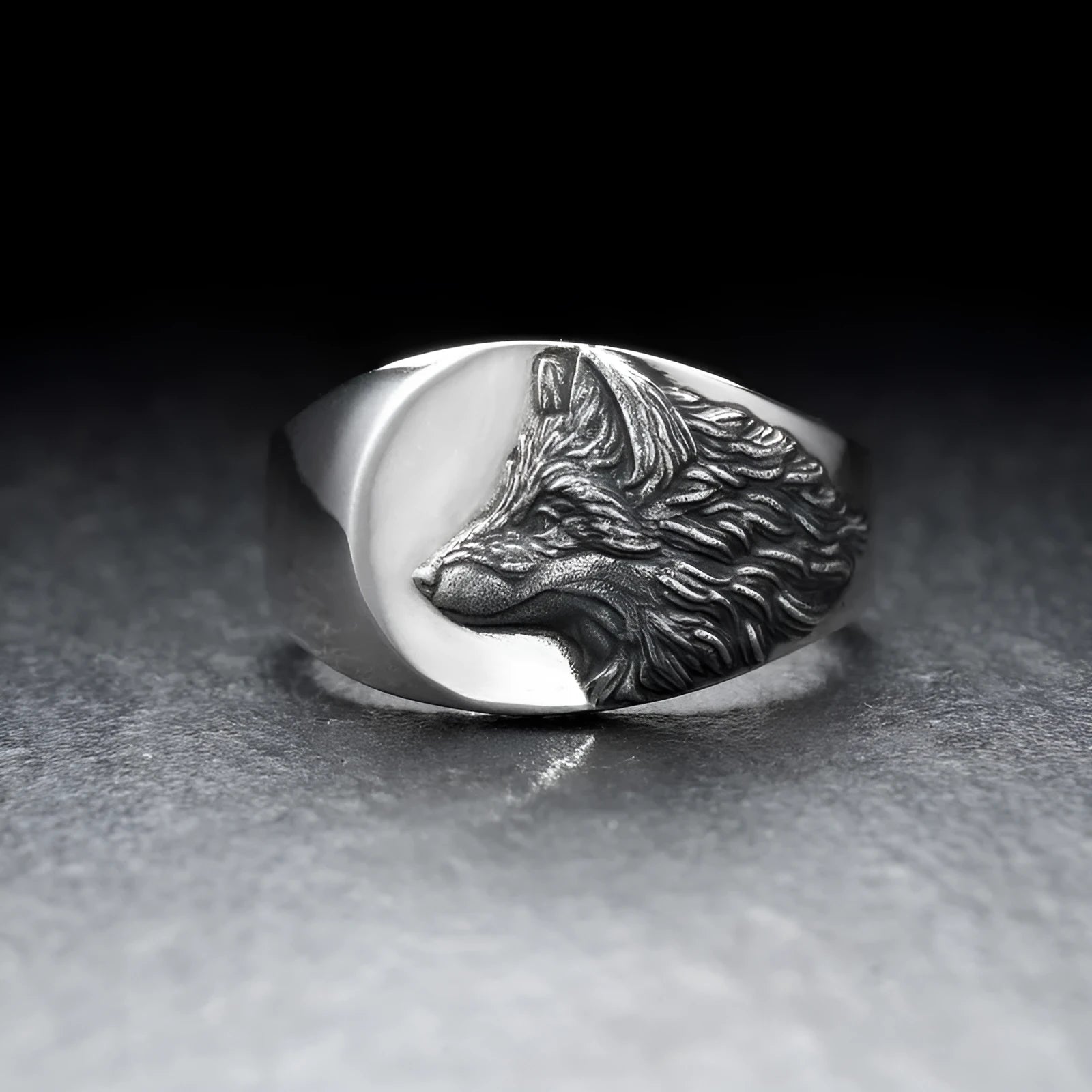 Men's silver wolf head alloy ring in geometric design on display