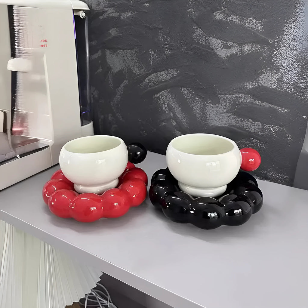 Ceramic coffee cup and saucer set in a choice of five colours, including coffee brown and bean green.