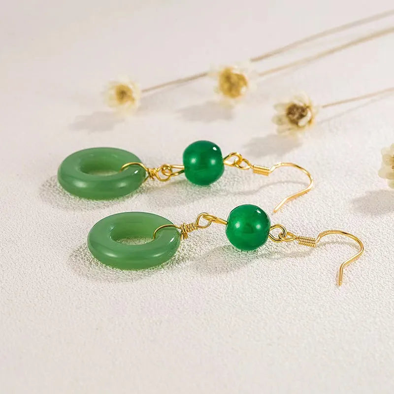 Green and gold Chinese style peace buckle shape earrings with geometric ring design.