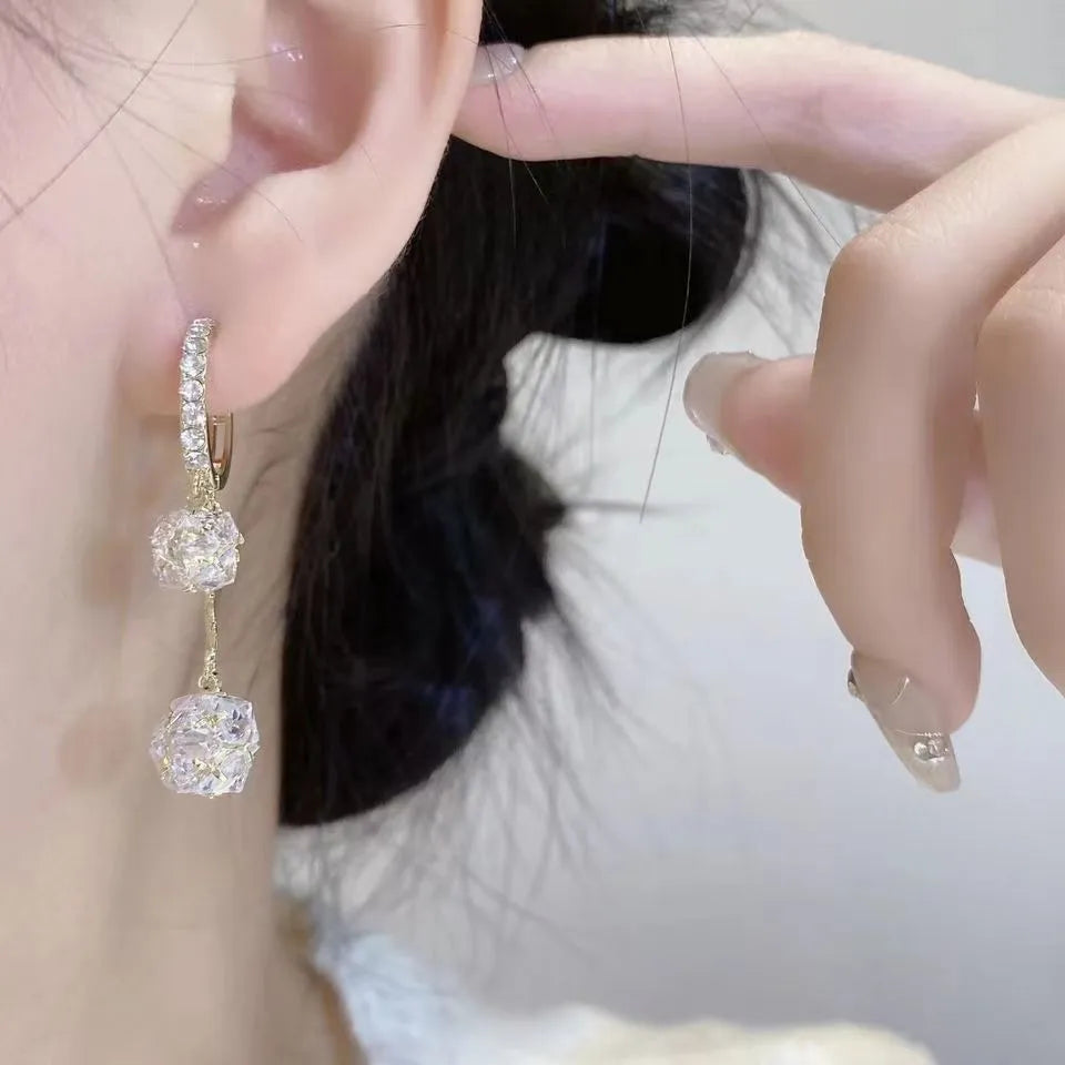 Women's silver drop earrings with tassel ball and rhinestone ball double pendant design, clip-on fastening