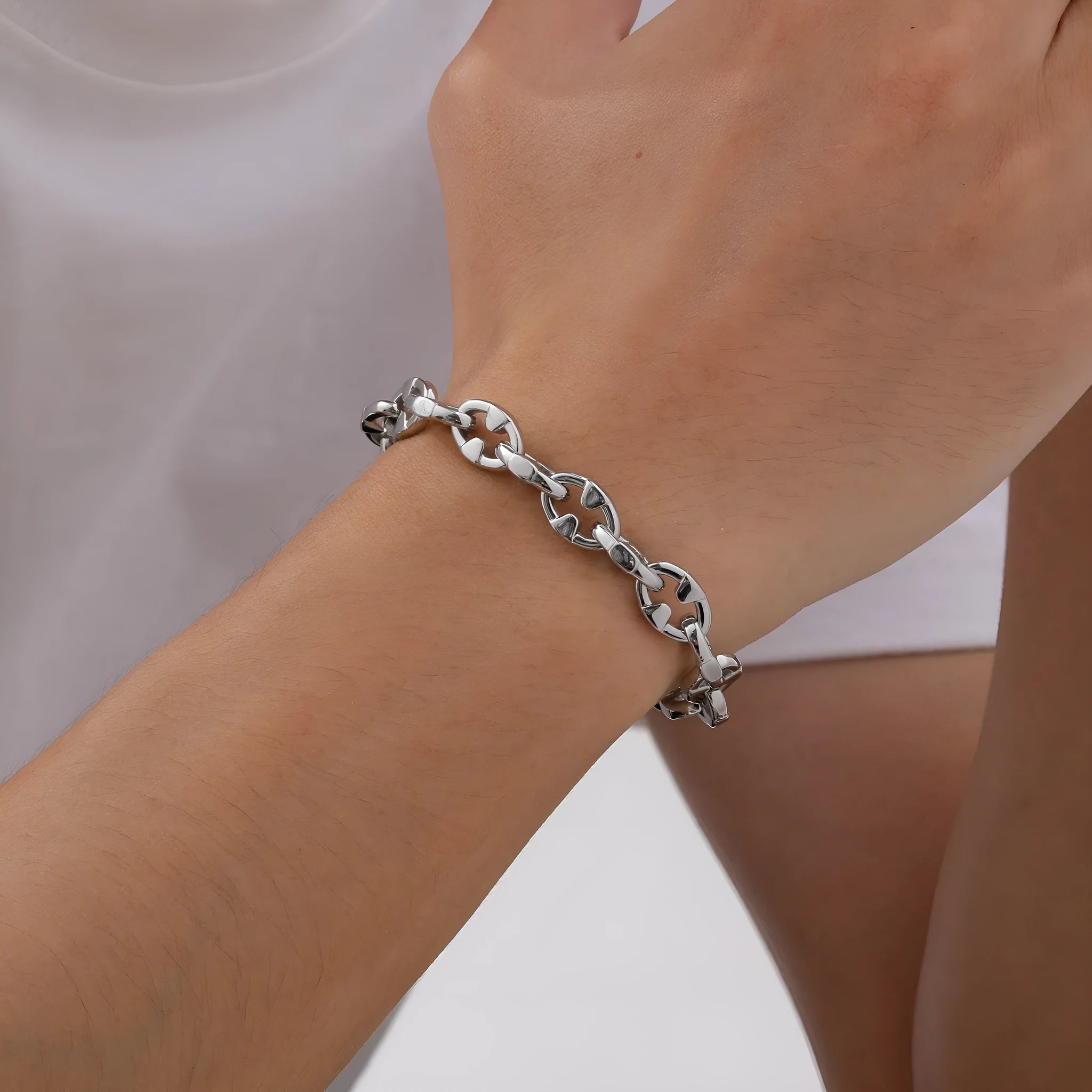 Thick stainless steel geometric chain bracelet for men, shown in steel colour.